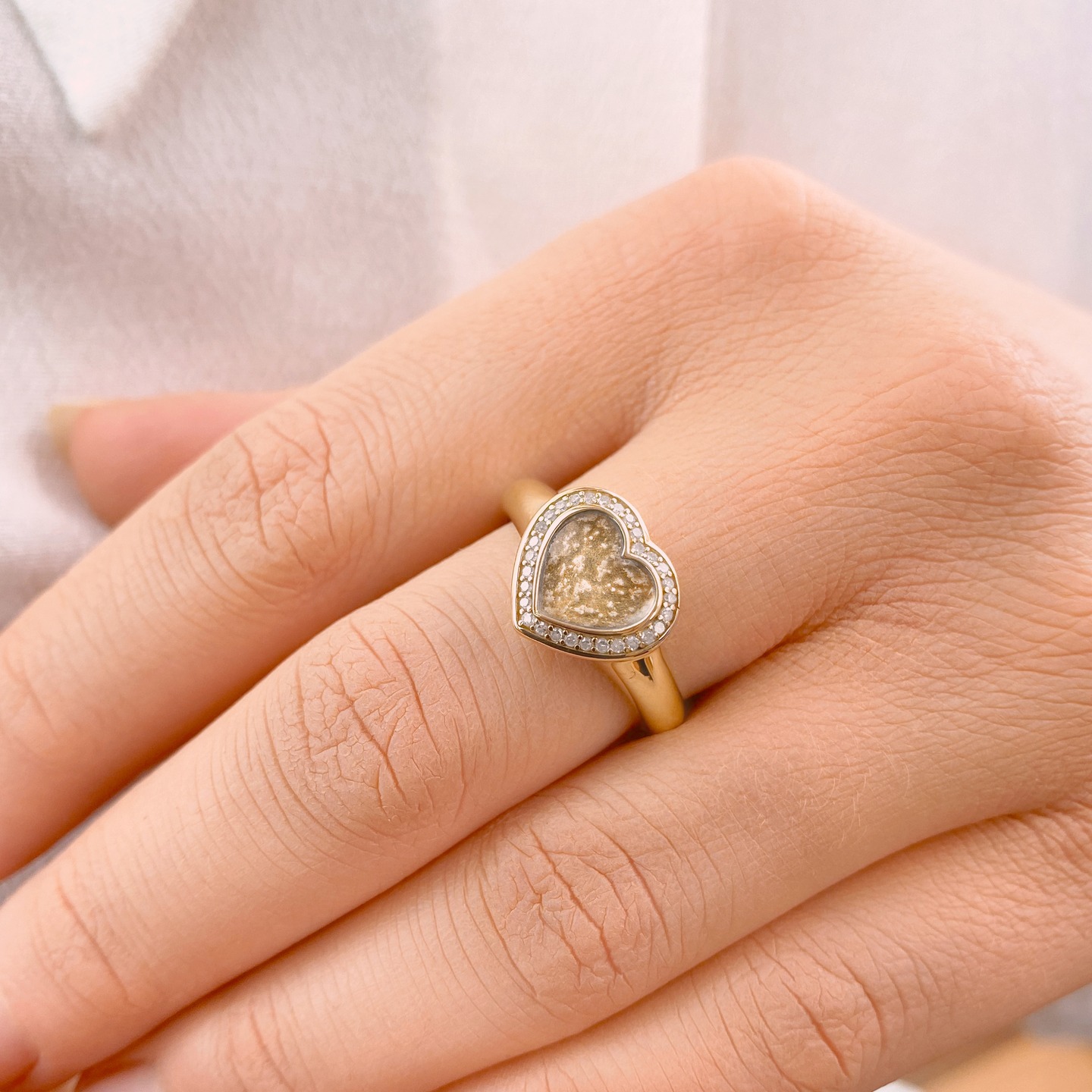 The Ashes into Glass Halo Heart Ring will bring you comfort whenever you wear it.
Each & every piece of Ashes into Glass memorial Jewellery is hand-crafted by our craftsmen, preserving the memories you hold dear.
Available in your choice of a range of glass colours & finished in Sterling Silver, Gold or White Gold metal mounts.
#ashesintoglass